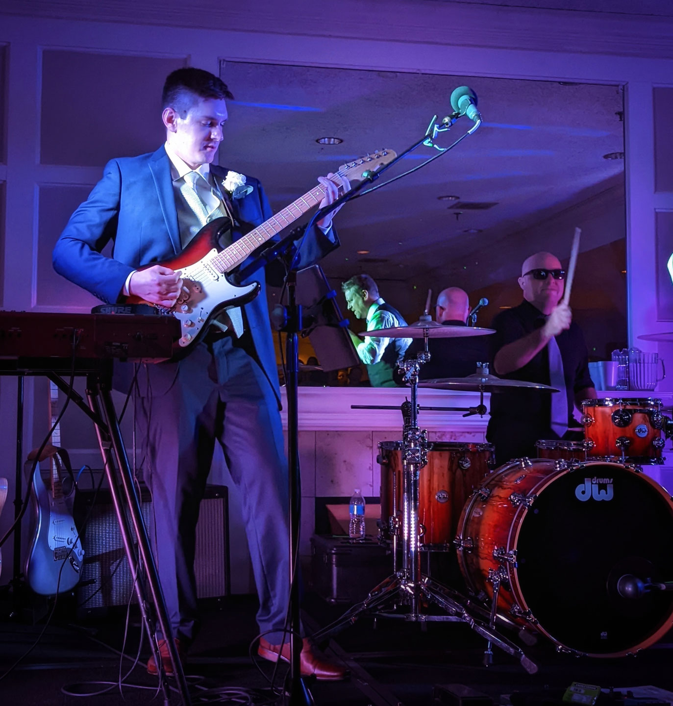 The groom casually turns up the volume